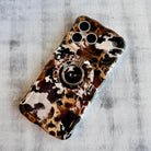 Rodeo Wild western cowhide pattern MagSafe phone grip ring with brown and black spots compatible with iPhone and Samsung