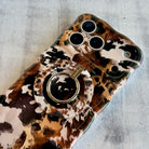 Rodeo Wild western cowhide pattern MagSafe phone grip ring with brown and black spots compatible with iPhone and Samsung
