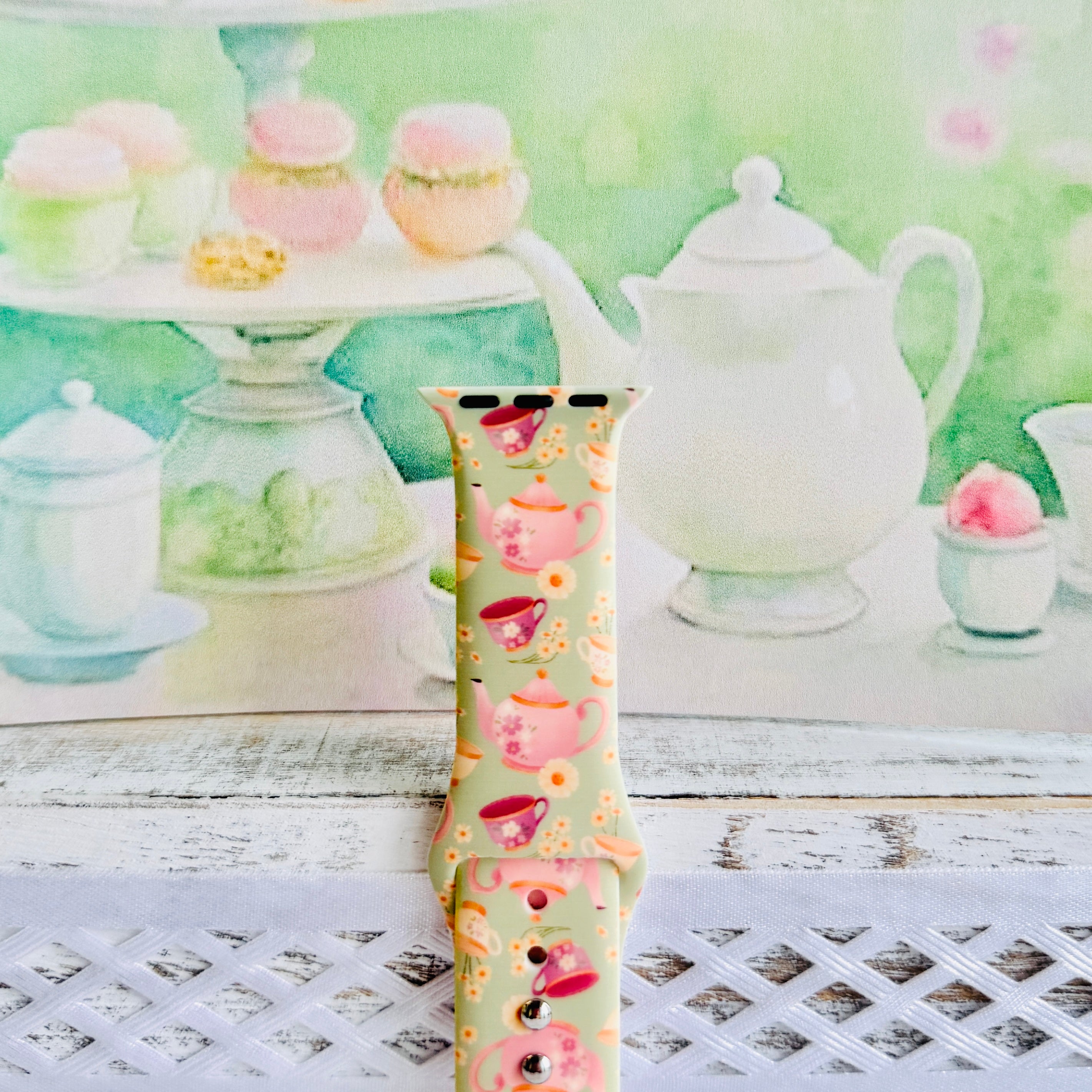 Tea Time Delight Apple Watch band with pink teapots and teacups on yellow-green background with watercolor tea party backdrop
