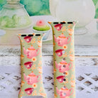 Tea Time Delight Apple Watch band with pink teapots and teacups on yellow-green background with watercolor tea party backdrop
