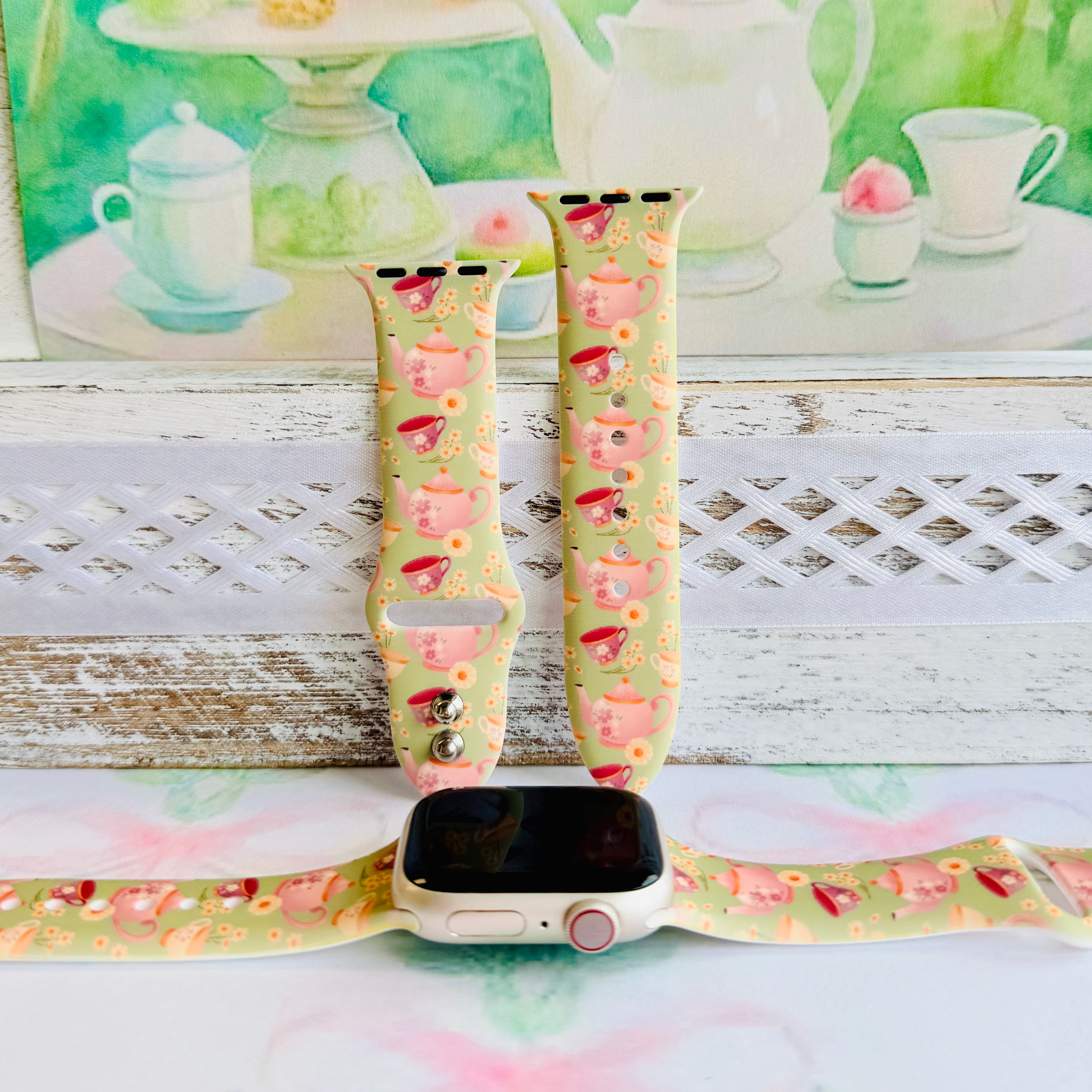 Tea Time Delight Apple Watch band with pink teapots and teacups on yellow-green background with watercolor tea party backdrop
