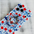 Cherry On Top pattern MagSafe phone grip ring with red cherries blue bows and gingham background compatible with iPhone and Samsung