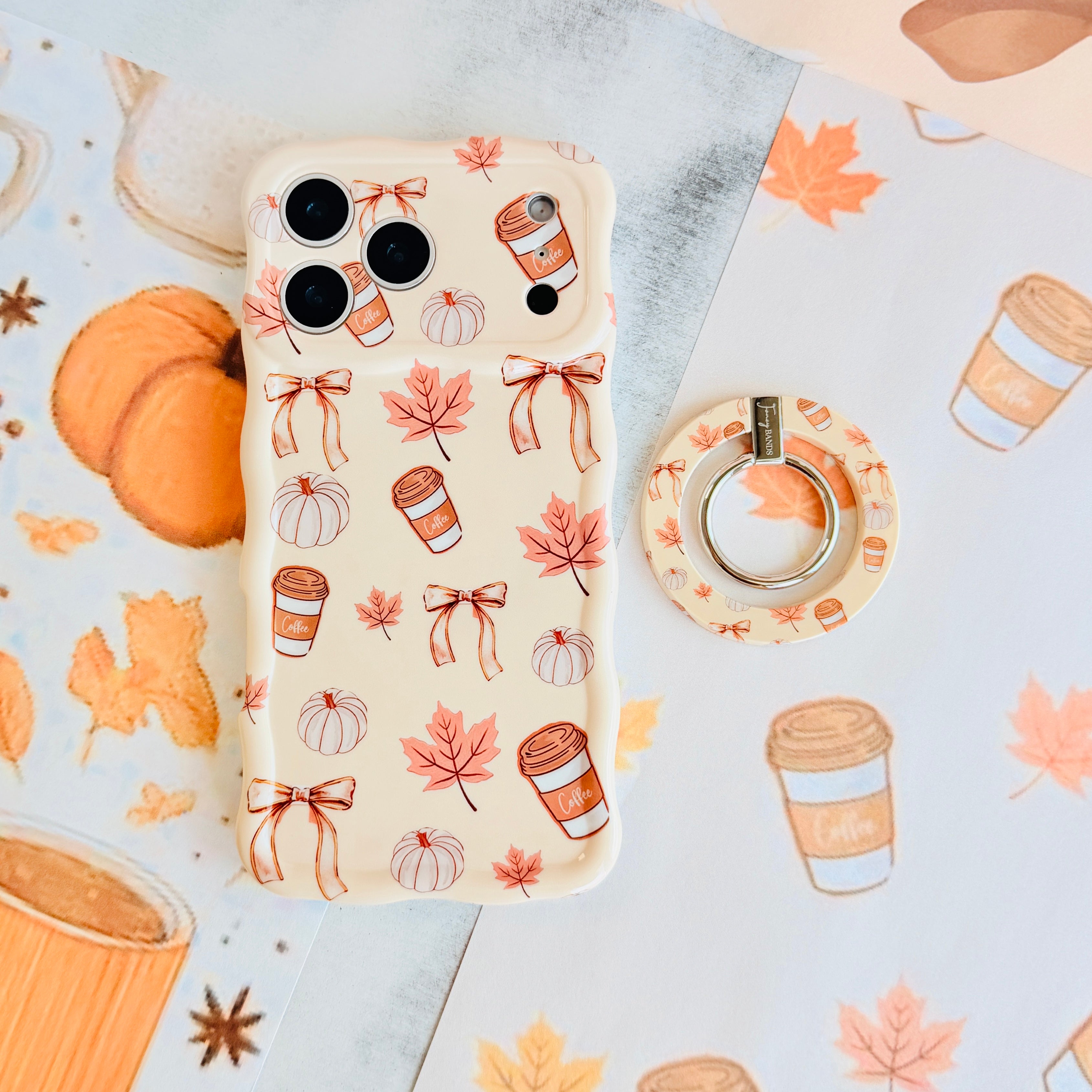 Falling in Love a Latte Hold It Fancy MagSafe grip ring with a cream coquette print of coffee cups, maple leaves, pumpkins and bows from Fancy Bands