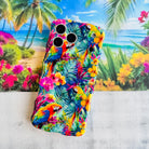Trendy wavy iPhone case featuring a vibrant tropical pattern of red macaws, pink hibiscus, and green palm leaves with a high-gloss finish.