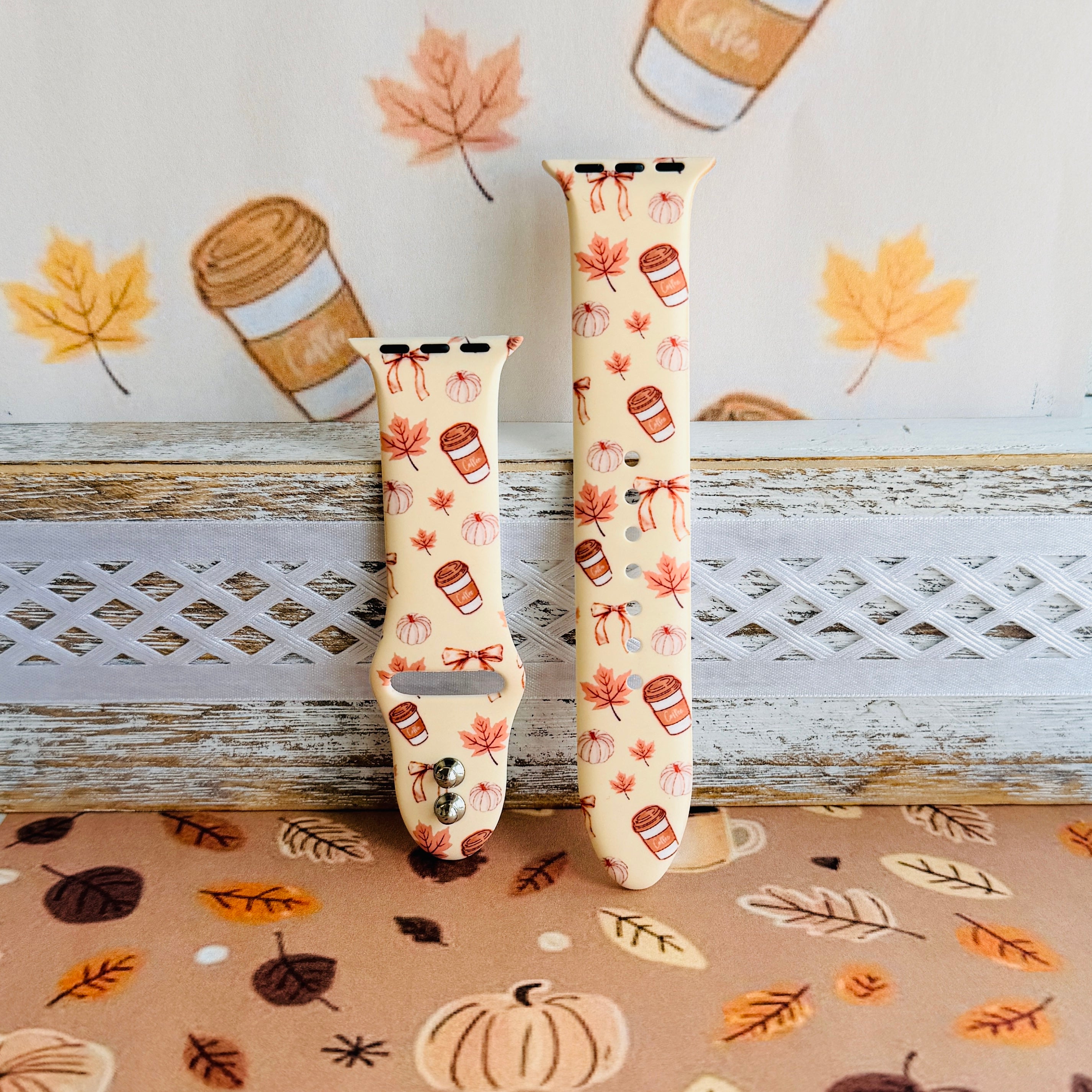 Falling in Love a Latte Apple Watch band shown in both size options side by side, cream coffee and pumpkin print.
