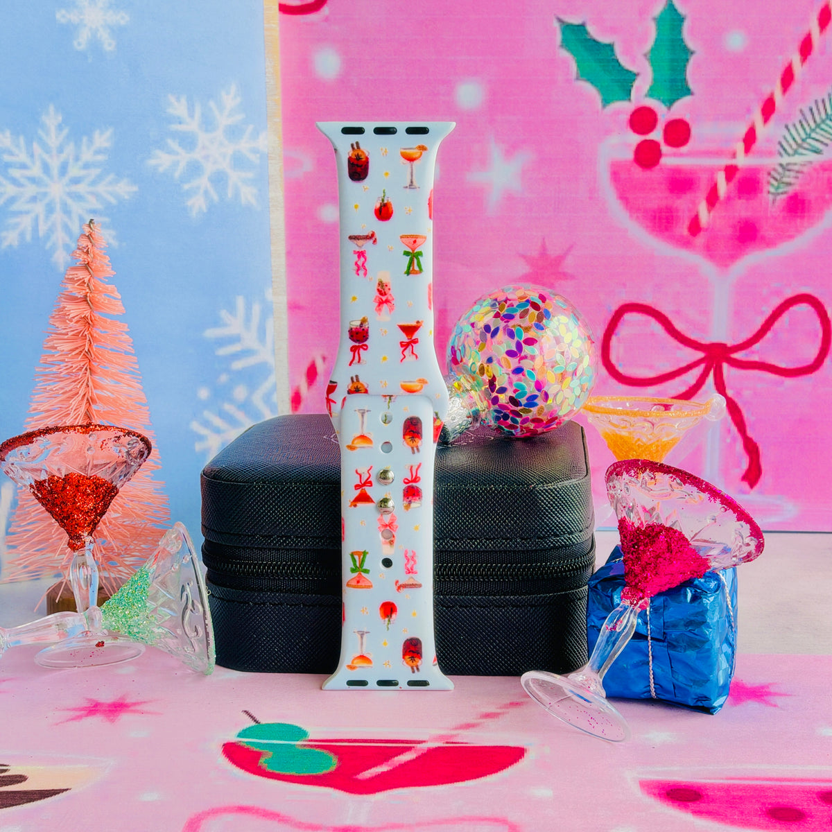 Holiday Spirits, Please? Apple Watch band buckled and standing on a jewelry box beside a sugar-rimmed martini glass and a sequin ornament