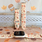 Falling in Love a Latte silicone Apple Watch band shown in both sizes with an Apple Watch at the base, cream with coffee cups, maple leaves, pumpkins and bows.
