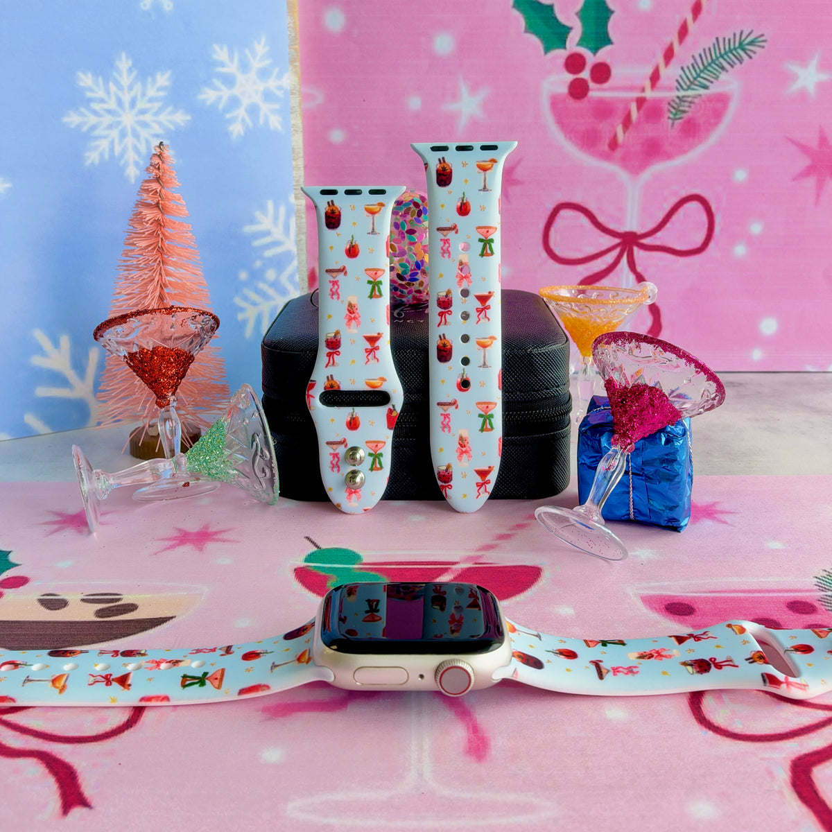 Holiday Spirits, Please? Apple Watch band on a rose gold Apple Watch and as two straps on a jewelry box, holiday cocktails and ribbon bows on powder blue