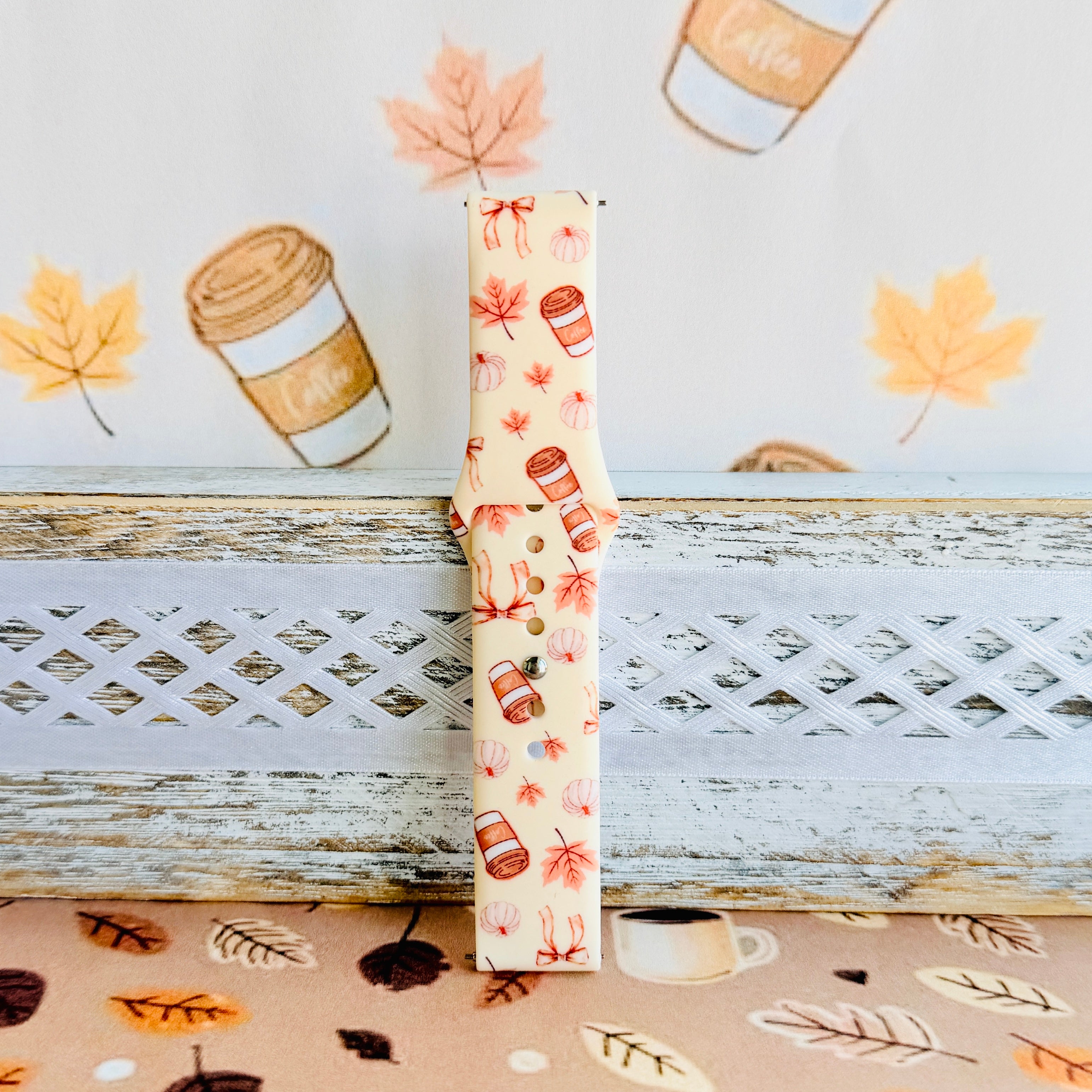 Falling in Love a Latte Samsung Galaxy Watch band standing full length against an illustrated latte and autumn leaf backdrop.