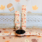 Falling in Love a Latte silicone Samsung Galaxy Watch band shown in both sizes with a round Samsung watch at the base, cream coffee and pumpkin print.
