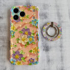 Blushing Bouquet textured oil painting style MagSafe phone grip ring with purple and yellow flowers on pink background compatible with iPhone and Samsung