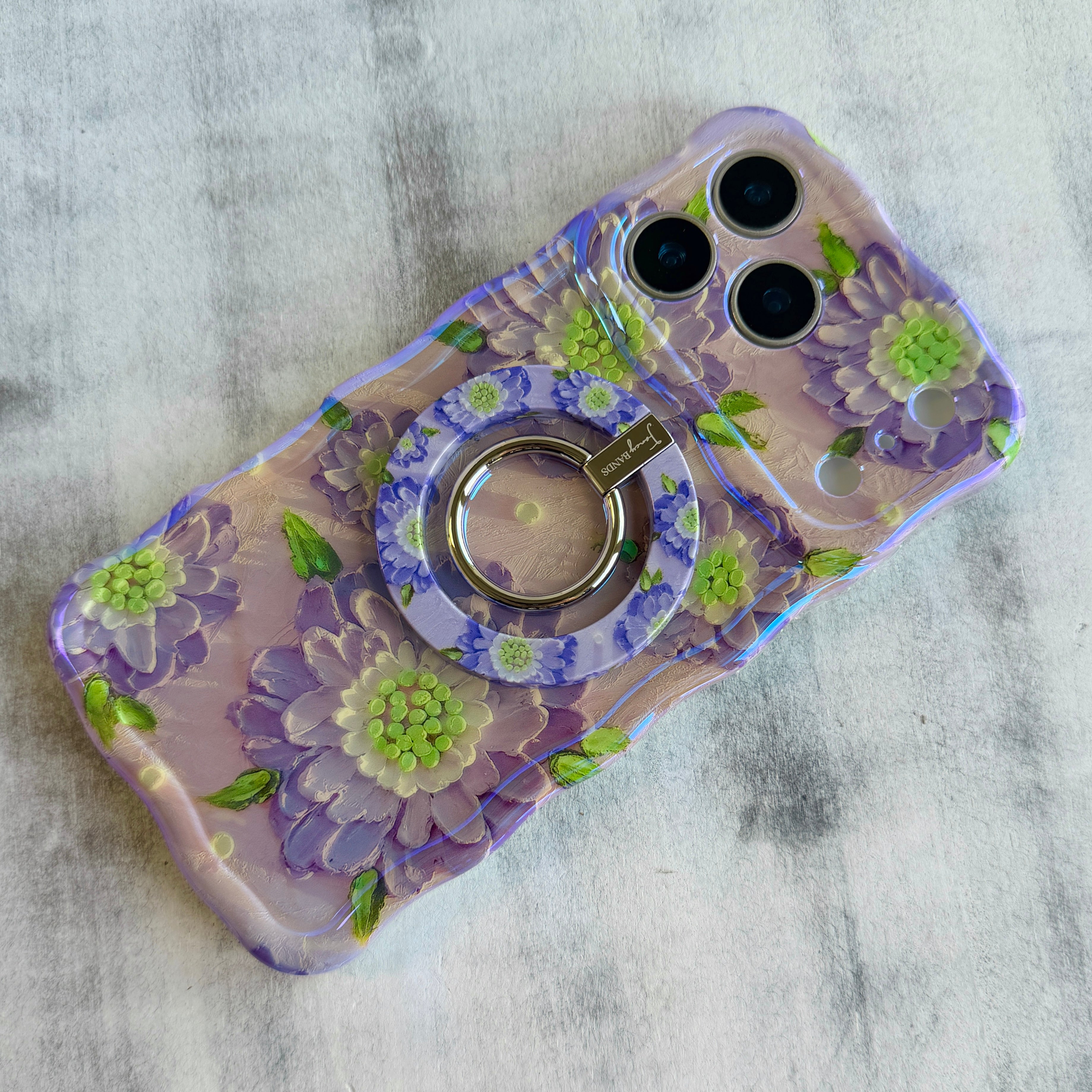 Purple Wildflower botanical pattern MagSafe phone grip ring with delicate purple pink and yellow flowers on white background compatible with iPhone and Samsung