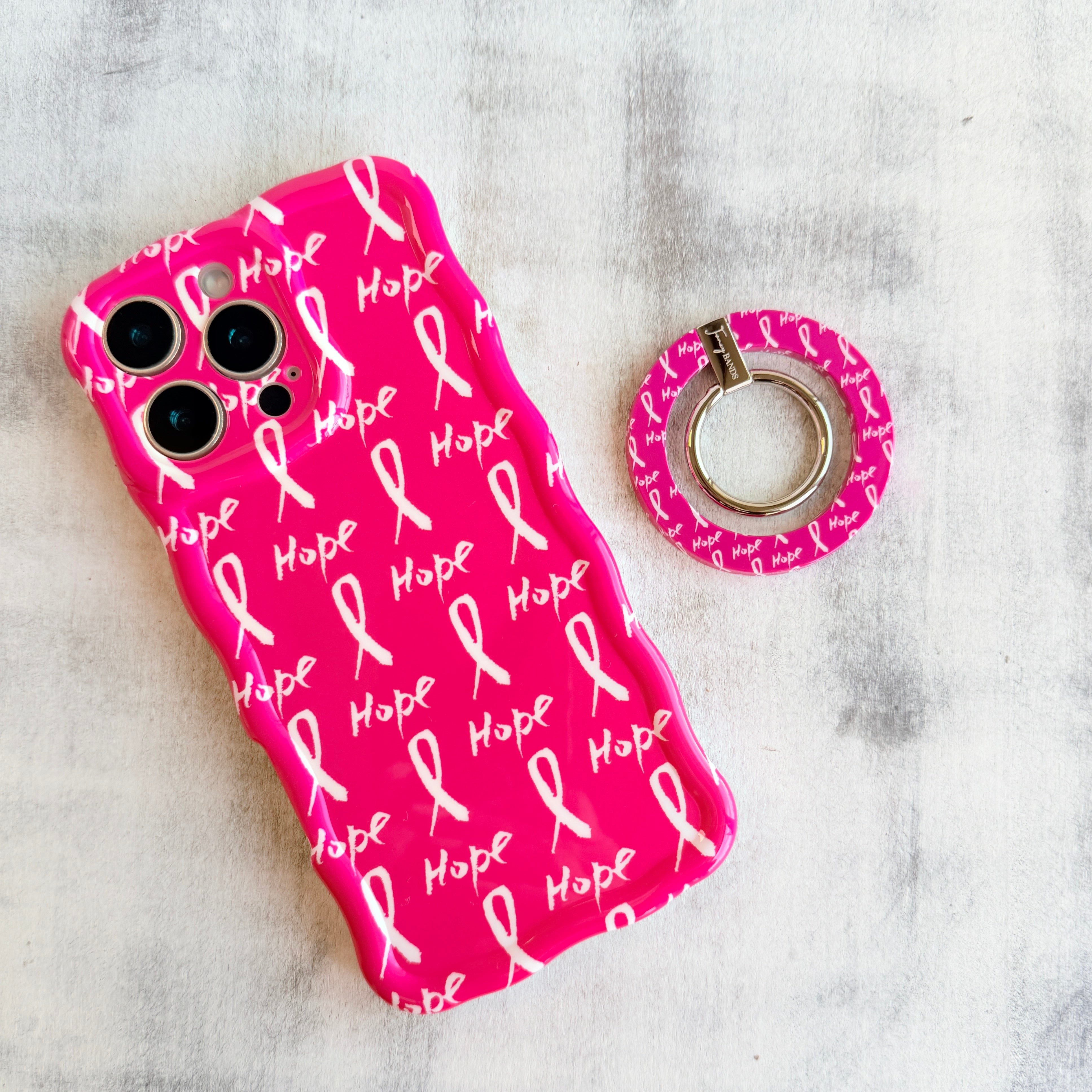 Hope Print MagSafe phone grip ring with pink background white awareness ribbons and hope text compatible with iPhone and Samsung