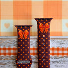 Spotted Looking Cute Apple Watch band front view of both strap halves, showing the orange bow near the top of each half and the polka dot print running the full length.