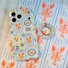 Coastal Catch MagSafe phone grip ring with orange lobster, blue stripes, and nautical postage stamp pattern compatible with iPhone and Samsung