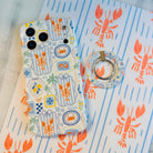 Coastal Catch Hold It Fancy MagSafe grip ring attached to the matching Coastal Catch iPhone case