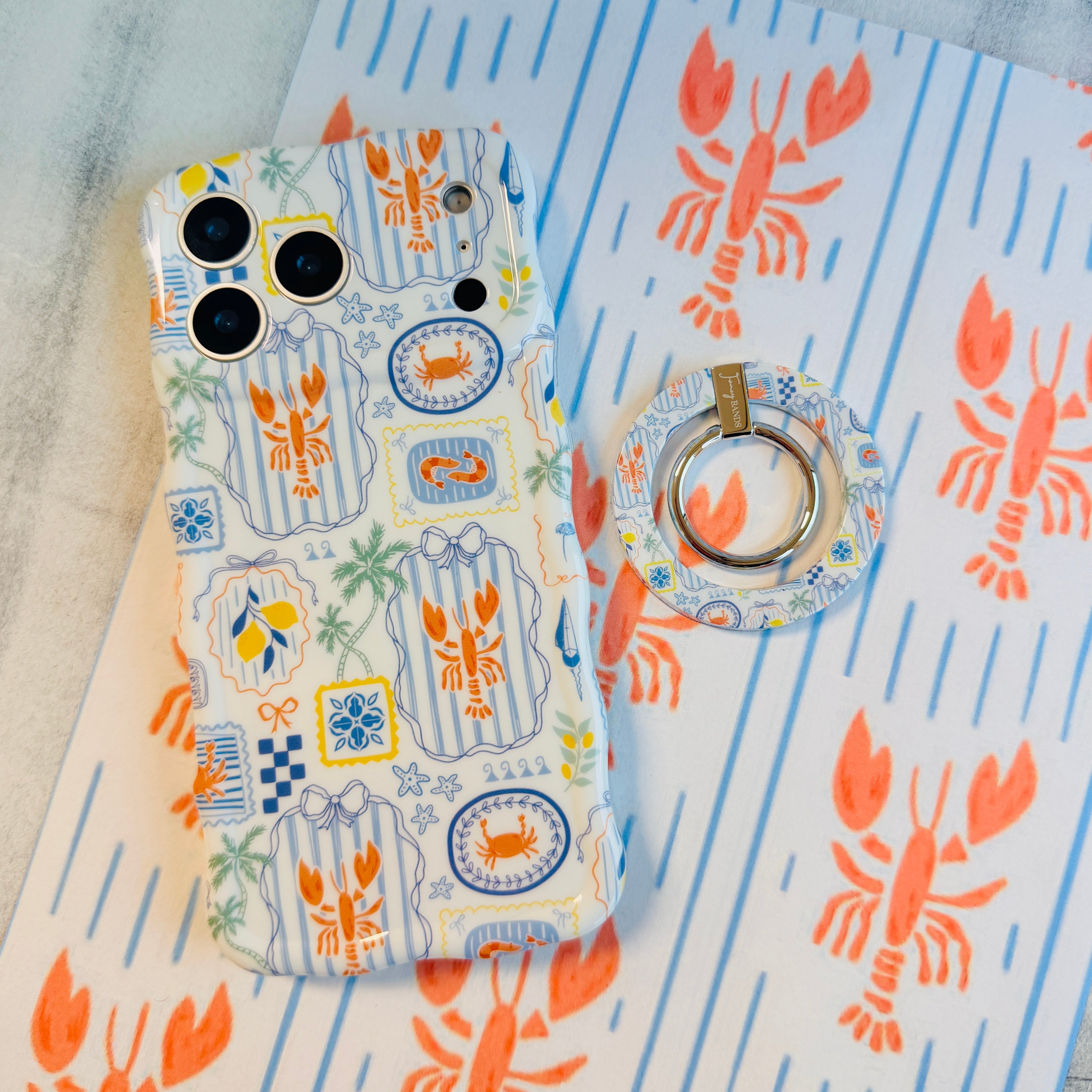 Coastal Catch Hold It Fancy MagSafe grip ring attached to the matching Coastal Catch iPhone case