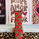 Kiss Me Leopard Apple Watch band with red glossy lips on tan leopard print styled with beauty and fashion decor
