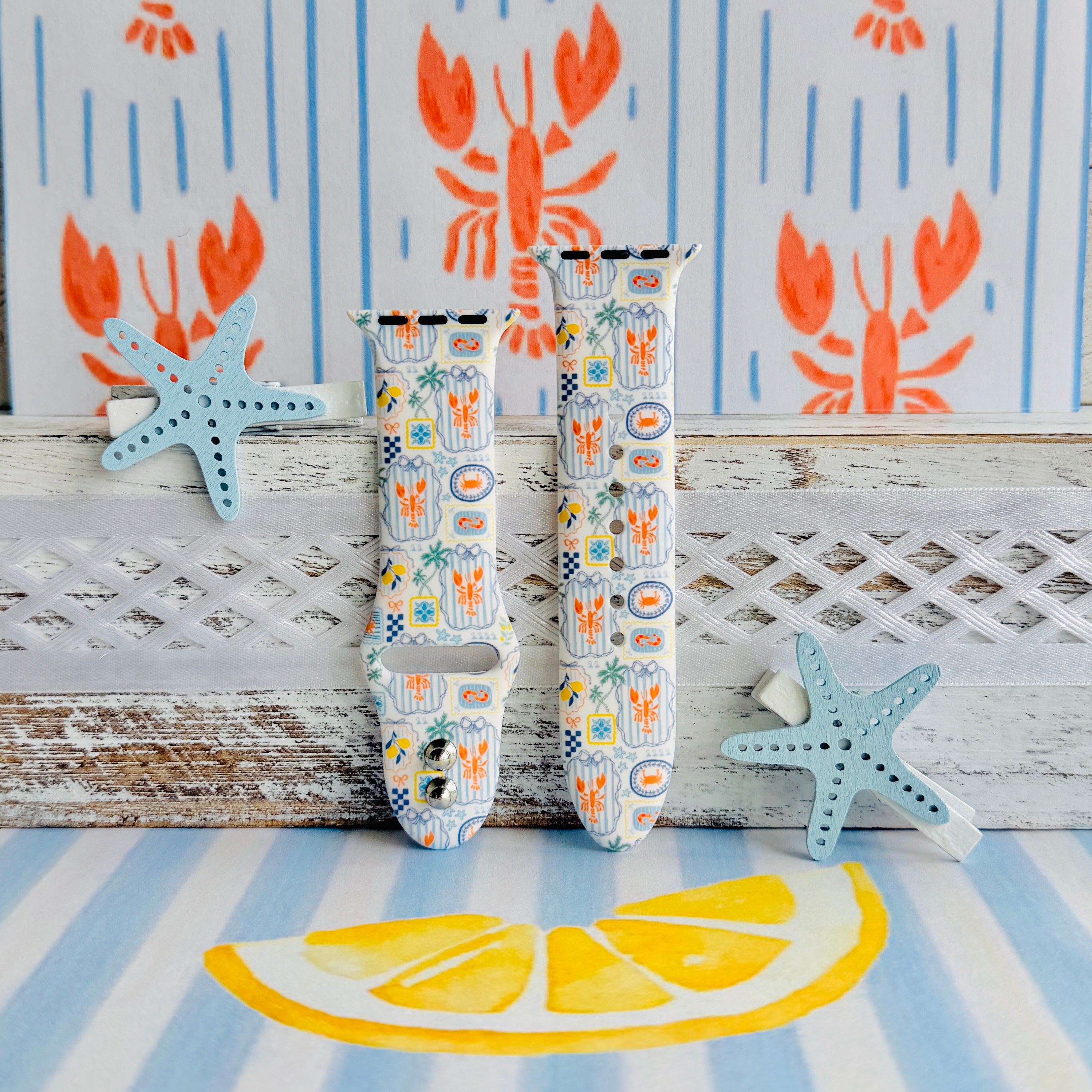 Coastal Catch Apple Watch band with orange lobsters, blue crabs, and yellow lemons on gray background with starfish decorations
