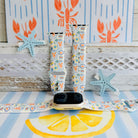 Coastal Catch Apple Watch band with orange lobsters, blue crabs, and yellow lemons on gray background with starfish decorations
