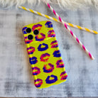 Neon yellow wavy iPhone case featuring a pattern of blue, pink, and red kiss lips in a pop-art style.
