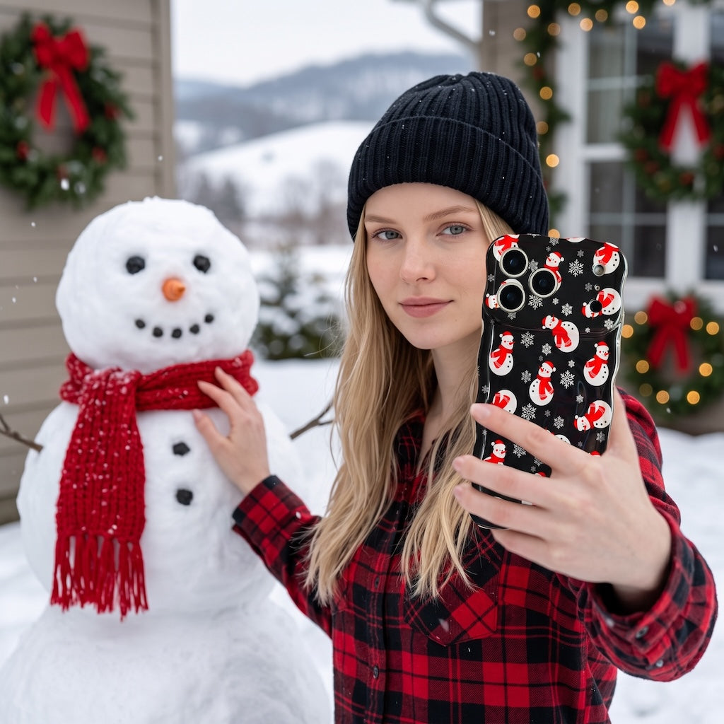 Blonde woman in a black beanie and red plaid taking a selfie with her Snowman iPhone case next to a snowman