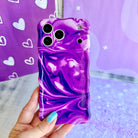 Grape Crush Wavy Luxe MagSafe iPhone case with a glossy purple liquid marble swirl design from Fancy Bands