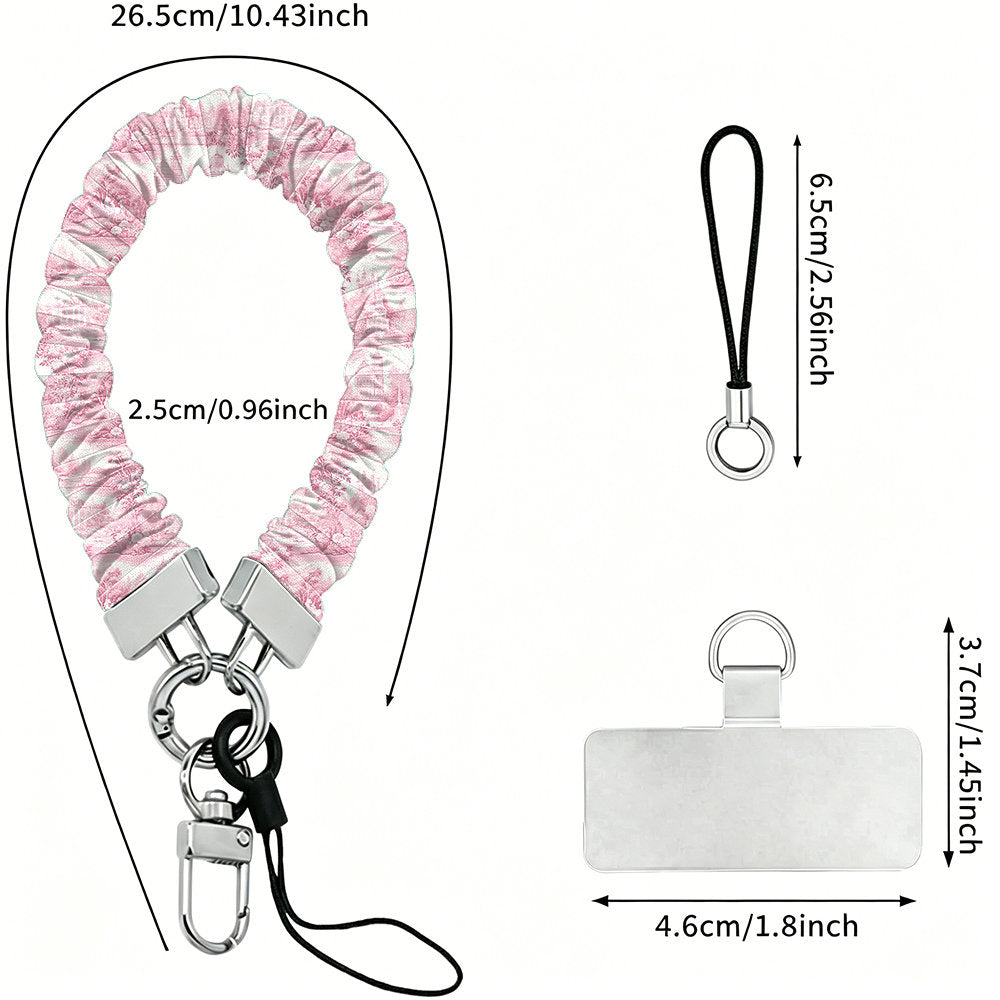 Size diagram for the Blush Manor Scrunchie Phone Wrist Strap, showing the 26.5 cm loop, 2.5 cm width and 4.6 cm phone attachment tab.