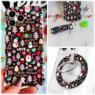 Jolly Wrist-mas iPhone Matching Set - black MagSafe case with Santas, snowmen and HO HO HO lettering, matching Hold It Fancy grip ring and scrunchie phone wrist strap from Fancy Bands