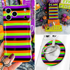 Main Witch Energy iPhone Matching Set: hand-held striped MagSafe case in black, purple, neon lime and orange, matching scrunchie wrist strap, and MagSafe grip ring
