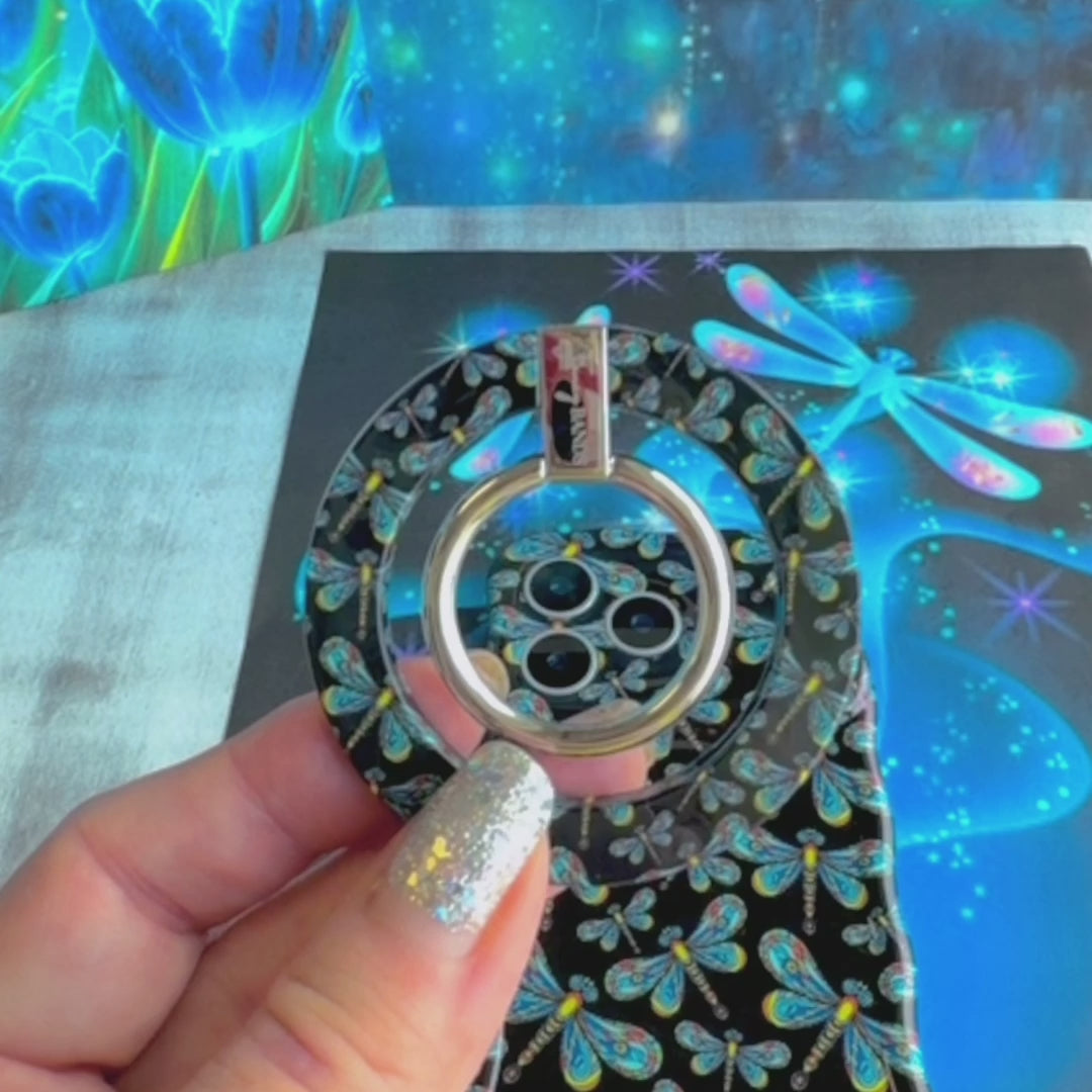 Dragonfly Dreams pattern MagSafe phone grip ring with colorful stained-glass style dragonflies on a black background compatible with iPhone and Samsung