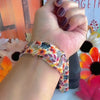 Video of the Sienna Petals silicone Samsung Galaxy Watch band worn on the wrist and shown in both sizes, cream with burnt orange watercolor flowers.