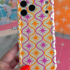 Trendy wavy iPhone case featuring a pink and orange starburst geometric pattern on a cream background with a high-gloss finish.