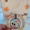 Falling in Love a Latte Hold It Fancy MagSafe grip ring with a cream coquette print of coffee cups, maple leaves, pumpkins and bows from Fancy Bands