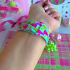 Video: Merry & Bright, Totally! Apple Watch band worn on the wrist, then both Christmas tree straps shown on a pink jewelry box