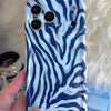 Video turning the Zebra, Obviously Wavy Luxe MagSafe iPhone case in hand to show the navy and white zebra print wrapping over the high-gloss sculpted wavy edges.