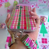 Video: clipping the Merry Little Plaid scrunchie phone wrist strap to the matching case and wearing it on the wrist