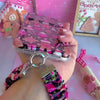 Video: wearing the Merry Mugs & Ginger Hugs scrunchie phone wrist strap on the wrist with an iPhone clipped on