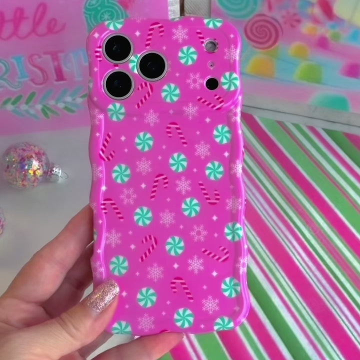 Video: turning the Peppermint Cutie Wavy Luxe MagSafe iPhone case in hand to show the pink peppermint print and wavy edges