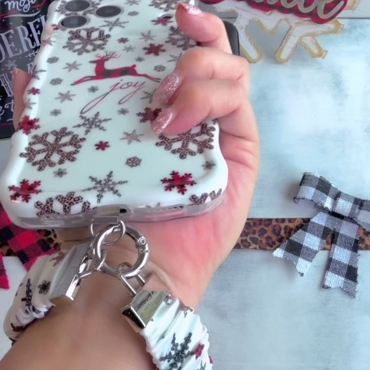 Video: Deer Joy White scrunchie wrist strap worn on the wrist with the matching reindeer iPhone case hanging from the clasp