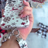 Video: Deer Joy White scrunchie wrist strap worn on the wrist with the matching reindeer iPhone case hanging from the clasp