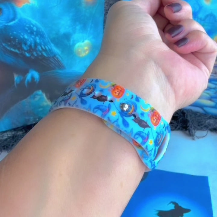 Video of The Bewitching Hour silicone Samsung Galaxy Watch band worn on the wrist with a round Samsung watch and shown in both sizes, light blue Halloween print.