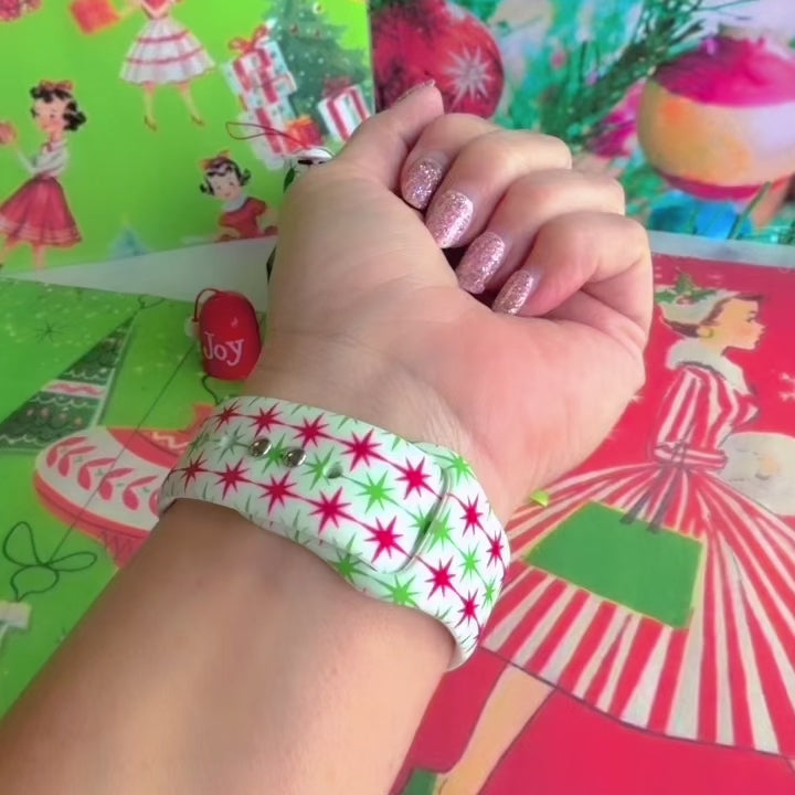 Video: Tinsel & Stardust Apple Watch band worn on the wrist, then both starburst straps shown on a jewelry box