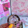Yee Haw Honey retro Western MagSafe phone grip ring with a cowgirl on a horse, pink cowboy hat, desert cacti, glittery stars, and animal print on a brown and pink background compatible with iPhone and Samsung