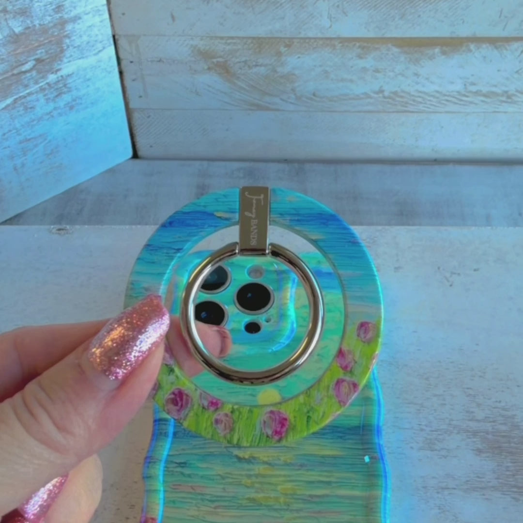 Coastal Bloom oil painting style MagSafe phone grip ring with blue sky and pink wildflowers compatible with iPhone and Samsung