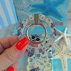 Blue Lagoon nautical watercolor MagSafe phone grip ring with sea turtles, whales, and jellyfish in shades of blue on a white background compatible with iPhone and Samsung