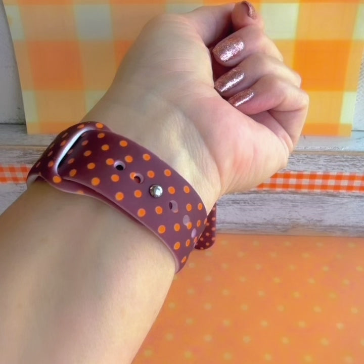 Video of the Spotted Looking Cute Samsung Galaxy Watch band showing the chocolate brown silicone, pumpkin-orange polka dots, and orange bow from every angle.
