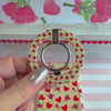 Sweetheart Blooms pattern MagSafe phone grip ring with red hearts and pink roses on cream background compatible with iPhone and Samsung