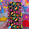 Trendy black wavy iPhone case featuring an intricate folk art botanical pattern of red flowers, magenta details, and yellow fan petals with a high-gloss finish.