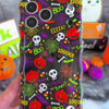 Video of the Spooky Wavy Luxe MagSafe iPhone case turning in hand to show the black pumpkin and skull print and the sculpted wavy edge.